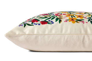 Side view of a cream 22x22 pillow with colorful floral botanical print by Rifle Paper Co.
