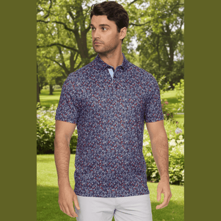Navy blue men's floral print performance polo with red white flowers on golf course