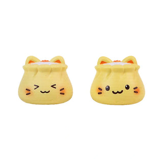 Two yellow cat-shaped squishes 