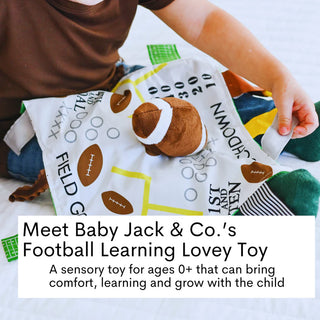Toddler lifting fabric tab on football lovey to reveal underside with game terminology