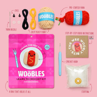 The Woobles Frank the Hot Dog beginner crochet kit showing all included components on pink background