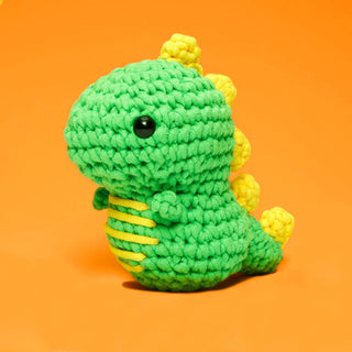 Woobles Fred the Dinosaur crochet amigurumi plush, green with yellow spikes and safety eyes