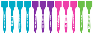 Colorful squishy cube toy pens in teal, purple, pink, and green with fun phrases