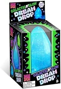 Glowing blue teardrop-shaped squishy toy in green Galactic Glow Dream Drop Needoh box