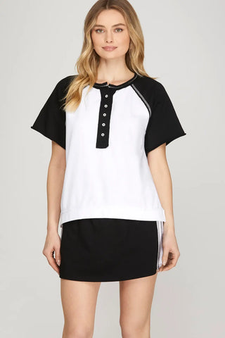White and black color block raglan short sleeve henley button-up knit top