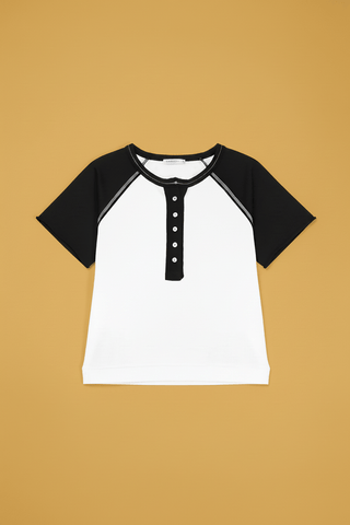White and black colorblock raglan short sleeve henley button-up knit top