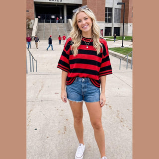 Red black striped gameday knit top for Texas Tech fans at stadium entrance