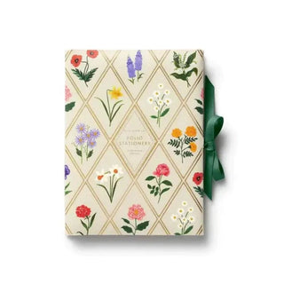 Floral-patterned gift box with a green ribbon