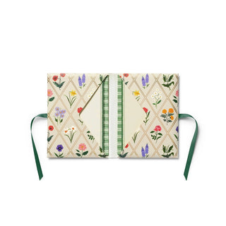 Floral-patterned notebook with a green ribbon