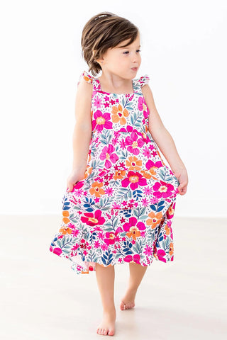 Young girl wearing a colorful floral dress 
