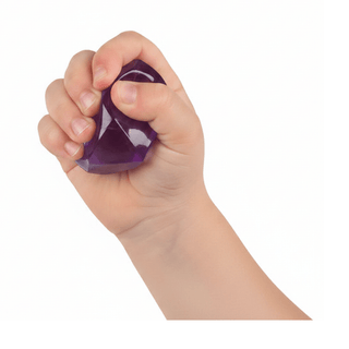 deep purple polyhedral squishy ball compressed by small hand revealing internal sugar granules
