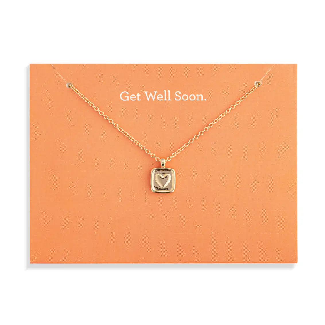 Gold necklace with a heart pendant on an orange card that says 'Get Well Soon'.