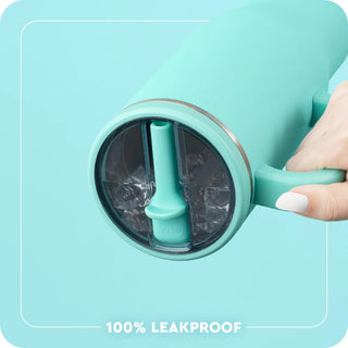 Leakproof transparent lid insert showing ice cubes in turquoise mug