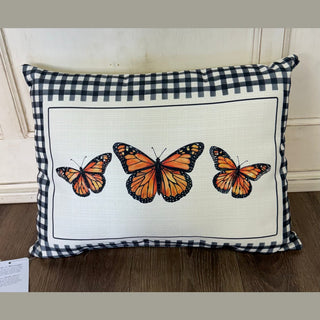 Gingham Monarch Pillow with black-and-white check border and orange butterfly print on textured polyester