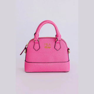 Vibrant fuchsia glitter dome purse for children with black trim and saturated sparkle finish