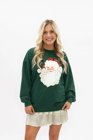 Green crewneck sweatshirt with glitter Santa Claus patch graphic on front
