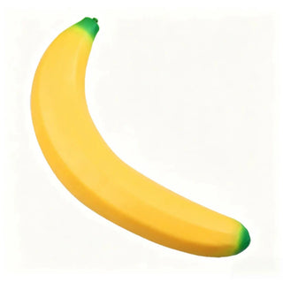Giant banana yellow slow rise squishy toy with green stem on white background