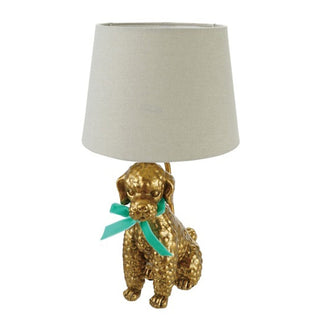 Gold resin poodle table lamp with teal bow and beige linen shade