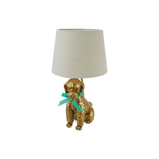 Gold resin poodle table lamp with cream shade and teal bow accent