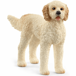 Schleich Goldendoodle figurine with cream curly fur and light brown shading, realistic hand-painted dog toy