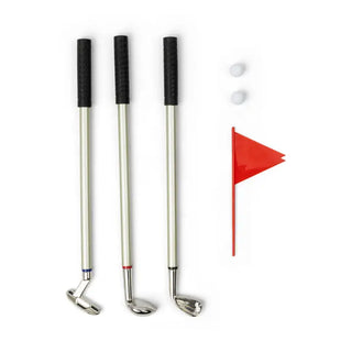 Three silver golf club pens with black grips, two white balls, and red flag