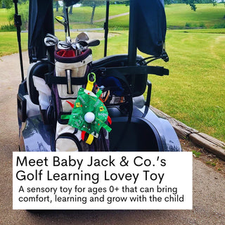 Green golf lovey clipped to golf bag on cart for on-the-go play