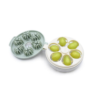 Harold Imports white and green grape tomato quartering tool with sliced grapes
