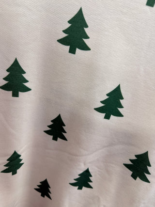White long sleeve top with scattered green Christmas tree print pattern