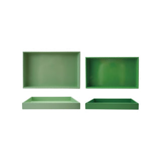 Four green trays with decorative edges 