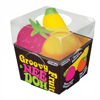 Box of 'Groovy Nee Doh' fruit-shaped toys with a banana, strawberry, and orange 