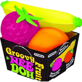 Colorful fruit-shaped toys in a box with 'Groovy Nee Doh' branding.