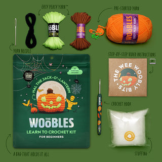 The Woobles Hal the Jack-O-Lantern beginner crochet kit with all included materials displayed
