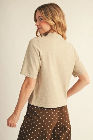 Jodifl oatmeal half sleeve cropped sweater top, back view, paired with brown polka dot pants