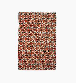 Halloween argyle fleece blanket with orange and cream diamond pattern featuring spooky icons