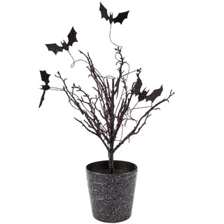 Black glitter bare branch tree with bat decorations in speckled black pot