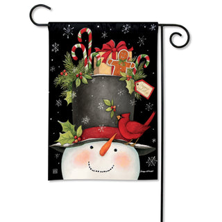 Garden flag featuring smiling snowman with top hat filled with holiday goodies and cardinal bird