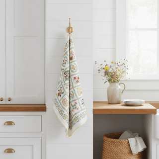 Helena Tea Towel hanging on hook in bright farmhouse kitchen