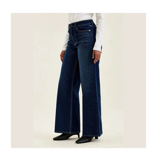 Close-up Judy Blue leather patch and embroidered back pocket detail on twilight blue jeans