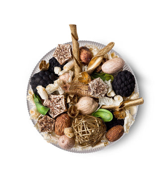 Aromatique Holiday Champagne decorative fragrance potpourri blend on white plate with gold accents