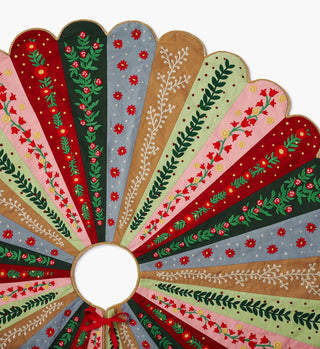 Holly Jolly embroidered Christmas tree skirt with multicolor panels featuring floral and botanical embroidery designs