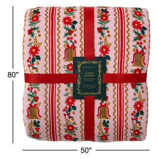 Rifle Paper Co Holly Jolly Fleece Blanket folded showing Christmas floral and bell pattern, 50x80 inches
