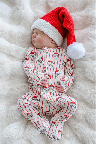 Sleeping newborn wearing Santa Claus print Christmas bamboo waffle zipper footie with matching knit hat