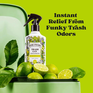 Poo-Pourri Lime Zest Matcha trash odor eliminator bottle on green lid surrounded by fresh limes and leaves