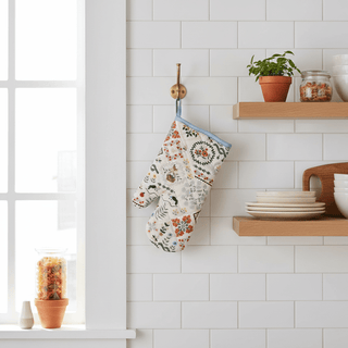 Home Sweet Home Oven Mitt styled hanging in kitchen