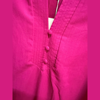 Hot pink dress front V-neck with fabric-covered buttons and visible stitching detail