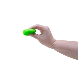 Hand holding a neon green Teenie Needoh stress ball on index finger tip