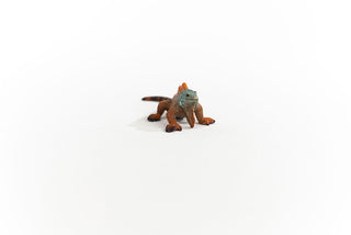 Schleich iguana figurine in orange and teal colors on white background