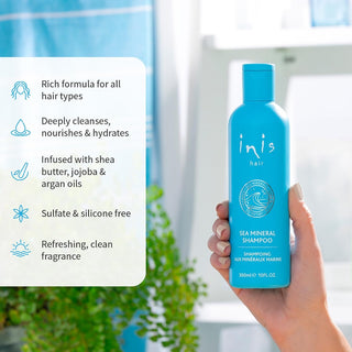 Matte turquoise Inis Sea Mineral Shampoo bottle with white text and ingredient seal held in hand