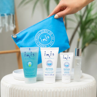 Inis Voyager Gift Set with shower gel, body lotion, hand cream, cologne spray, and blue cosmetic bag