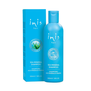 Blue shampoo bottle and box with 'inis hair' branding